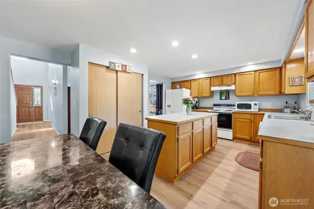 Kitchen with large pantry and lots of cabinets.