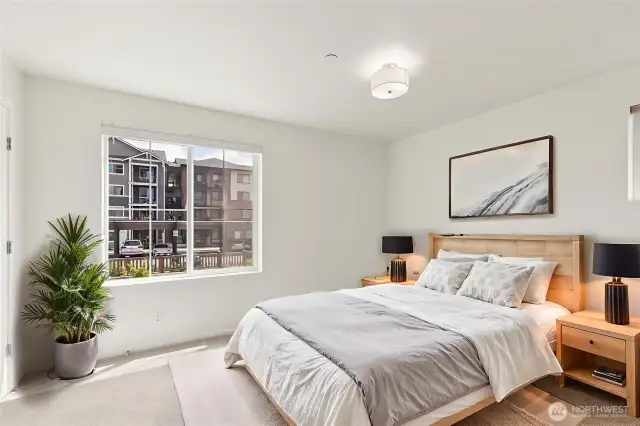 Bright and generously sized, the primary suite offers a luxurious retreat with room to relax, recharge, and make your own. A perfect blend of comfort and space.