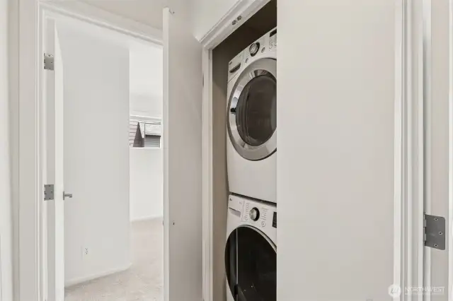 Conveniently located near the main bedrooms, the stackable washer and dryer offer efficient laundry access without sacrificing space or style.