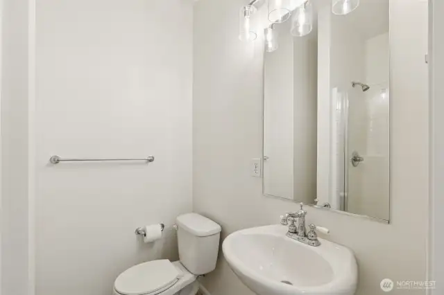 Stylish main-level full bathroom features updated finishes and convenient access—ideal for guests or everyday use with a clean, modern aesthetic.