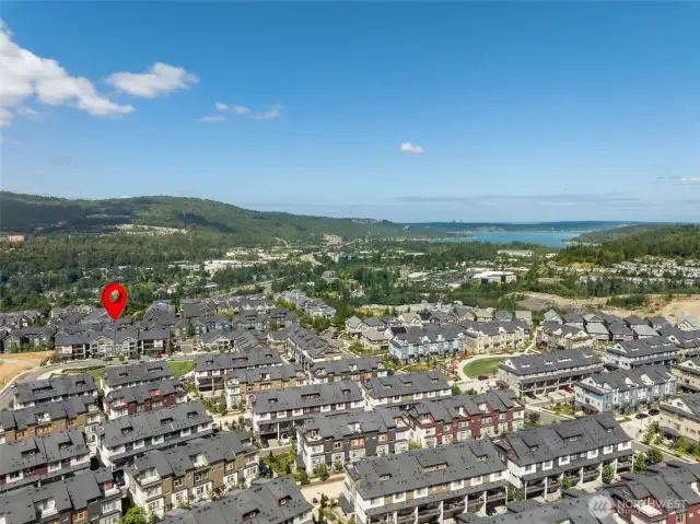 A sweeping view of the Issaquah Highlands reveals a vibrant, master-planned community surrounded by green space, walking trails, parks, and urban amenities—all just minutes from the townhome.