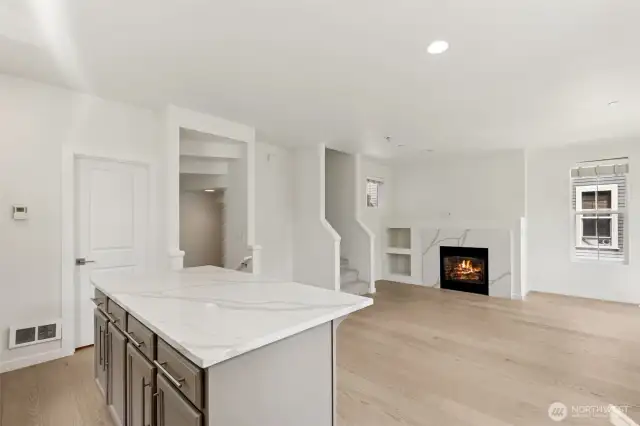 View from the kitchen showcases the seamless flow into the dining and living areas—highlighting the home’s open-concept design, perfect for connection, comfort, and entertaining.