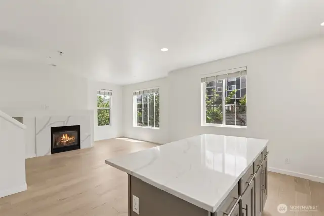 The central island stands out with beautifully updated counters—providing extra prep space, casual seating, and a stylish focal point for the heart of the home.