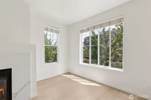 Charming architectural details include cozy nooks and corner window seating areas—perfect for reading, relaxing, or simply enjoying the natural light and surrounding views.