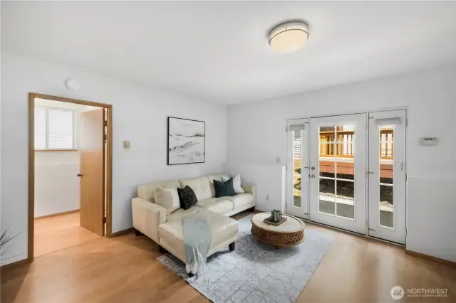Set beside the family room is a convenient half-bath and the laundry room, which includes the washer and dryer.