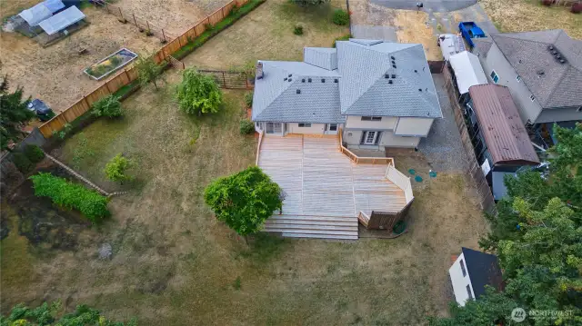 An aerial view of the property, showcasing the surrounding landscape and architectural details.