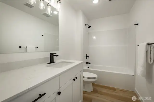Photos shown are of a similar floor plan previously built in a different neighborhood (The Ridge in Blaine). Finishes and features may vary. Some items pictured reflect buyer-selected upgrades which are not included in the base price and may be added at an additional cost.