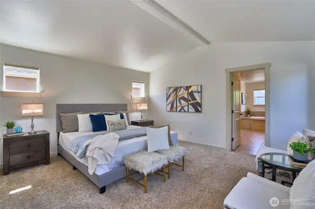 Upon going up the stairs you are greeted by French doors leading into the primary suite