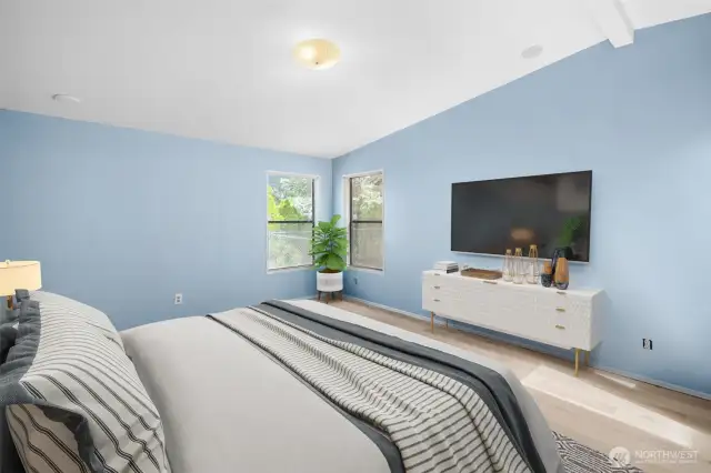 Large & airy primary bedroom with new flooring