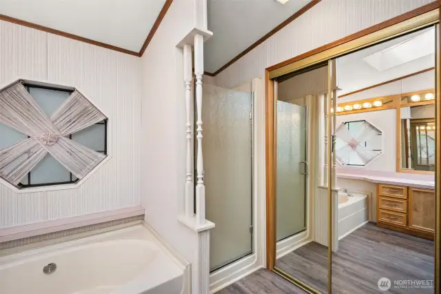 Behind the mirrored doors….a HUGE walk-in closet!
