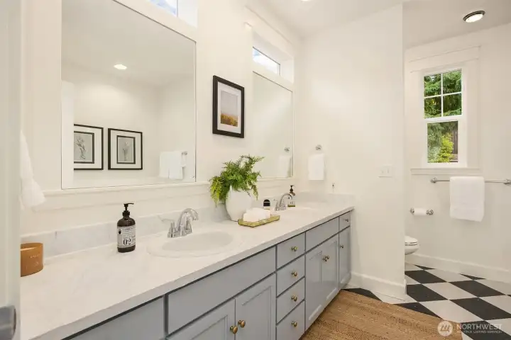 The primary bath with shower and soaking tub.
