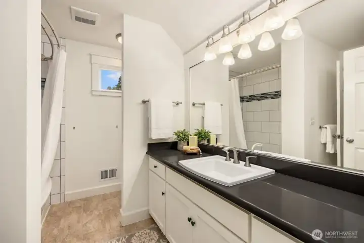 The upper full bathroom.