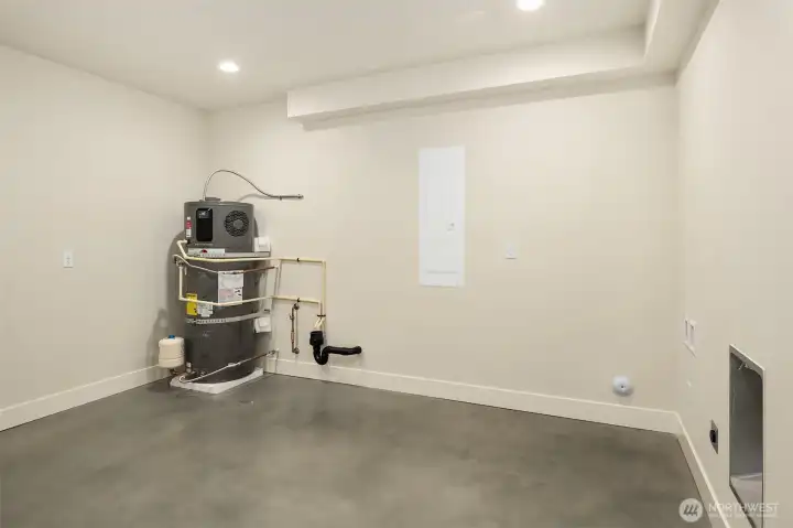 The lower level includes an extra large utility storage space with room for a washer/dryer and tons of storage.