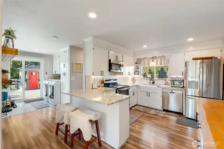 Chefs kitchen featuring new quartz countertops…