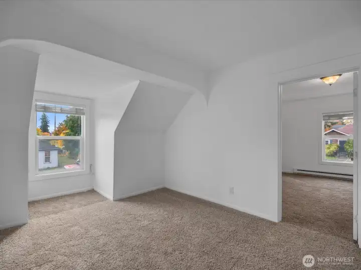 The upper level light, inviting living room.