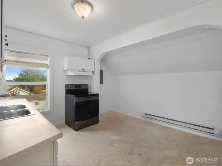 Generous eating space included in the upper level kitchen. This level has baseboard heat.