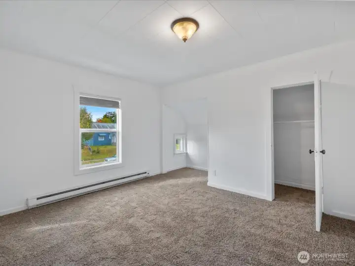 The bedroom also features access to the den or office on the upper level.