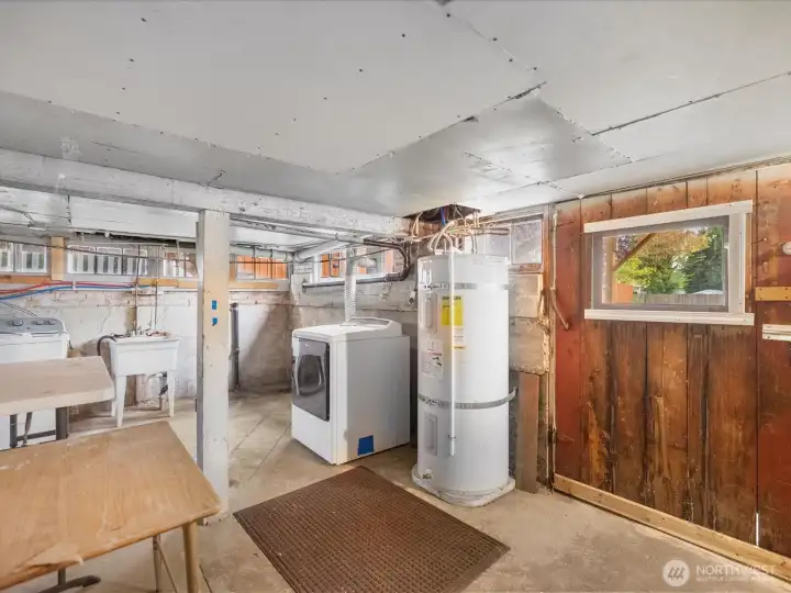 The basement has loads of work and storage space.