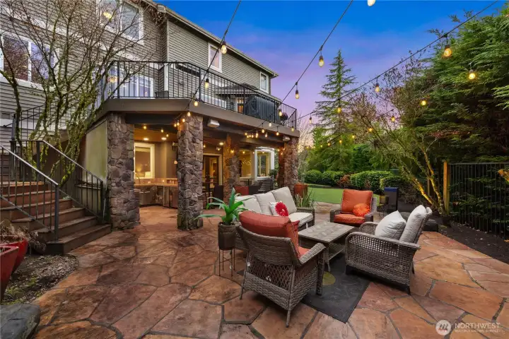 Gorgeous slate floor create a true 'NW' living room ambiance outdoors. The steps lead up to the main level deck.