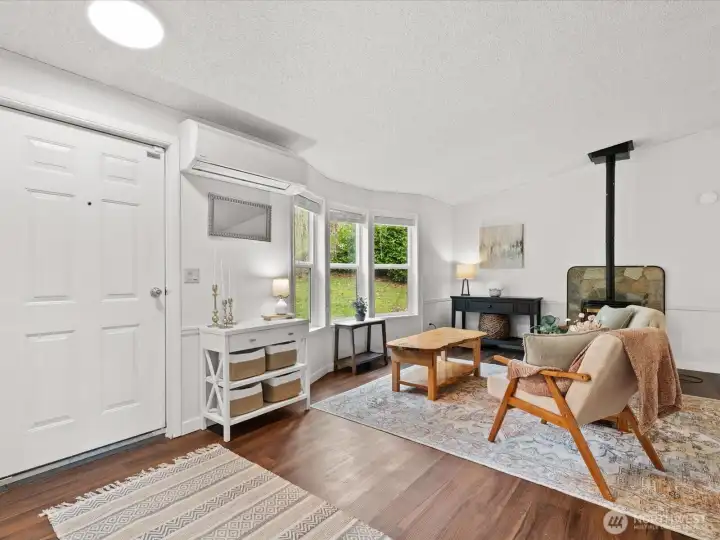Entry way into living room with pellet stove