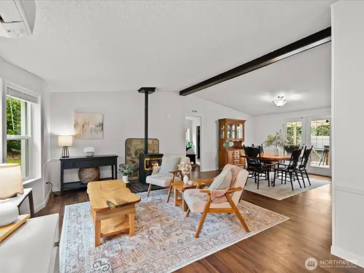 Living room & dining room with vaulted ceilings.