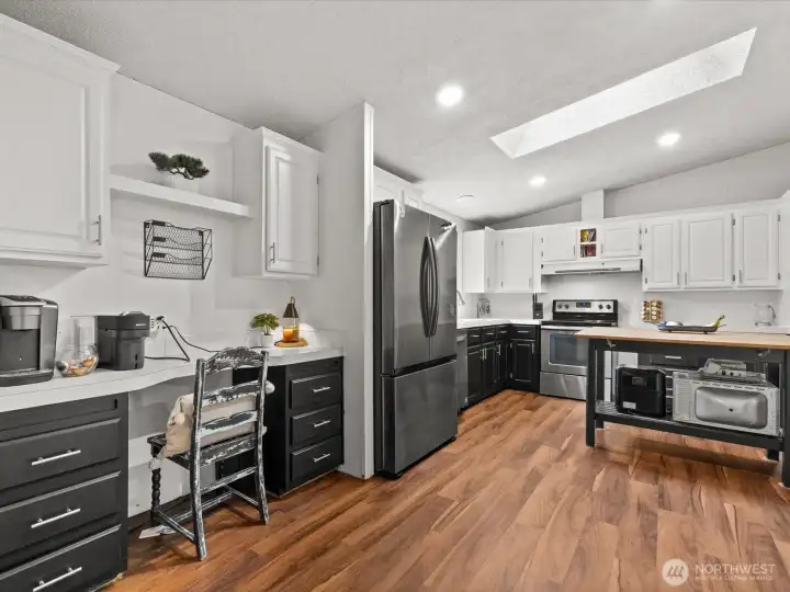 Kitchen with desk area. All appliances stay.