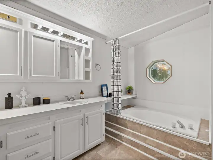 Primary 5piece bathroom with soaking tub.