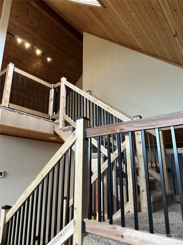 Stairs to primary en suite and loft.