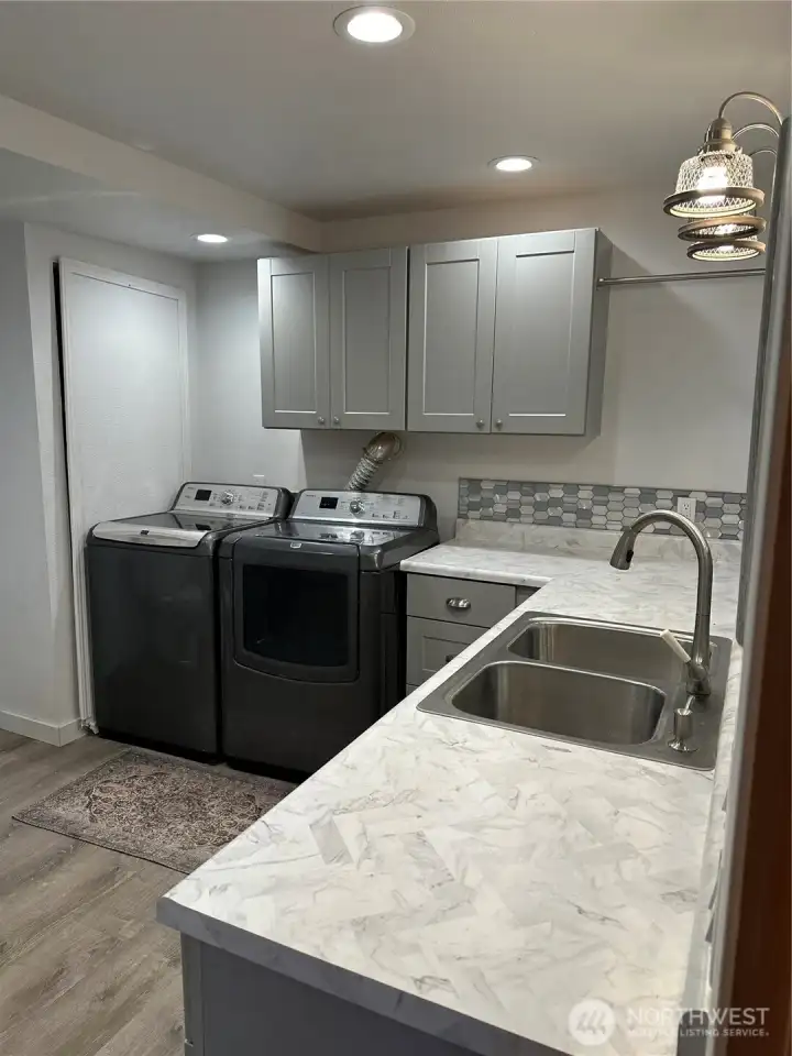 laundry room with 3/4 bath.
