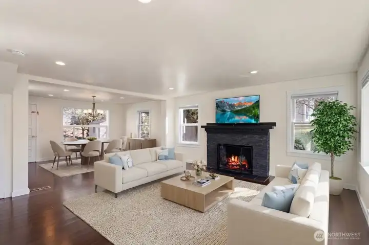The heart of the home is an expansive, open-concept living and dining area, seamlessly unified by a Dover White color drench.