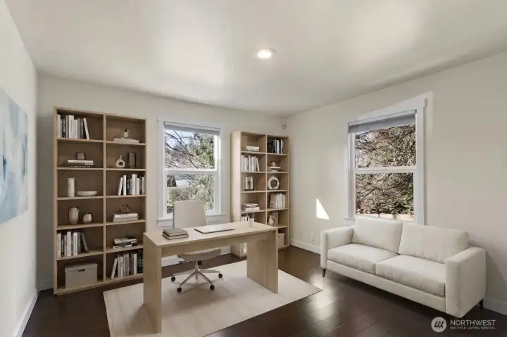 Main-level  bedroom with adjusent 3/4 bath - flexible space for guests, office, or extended living.