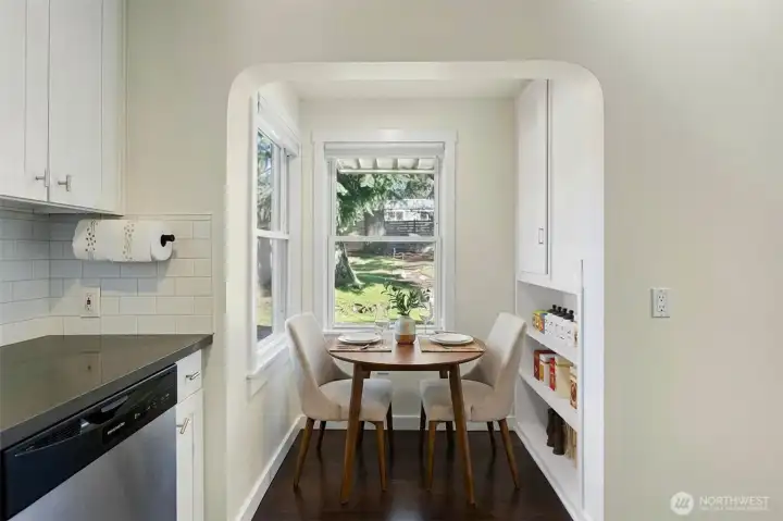 Cozy breakfast nook off the kitchen looking onto a private backyard.