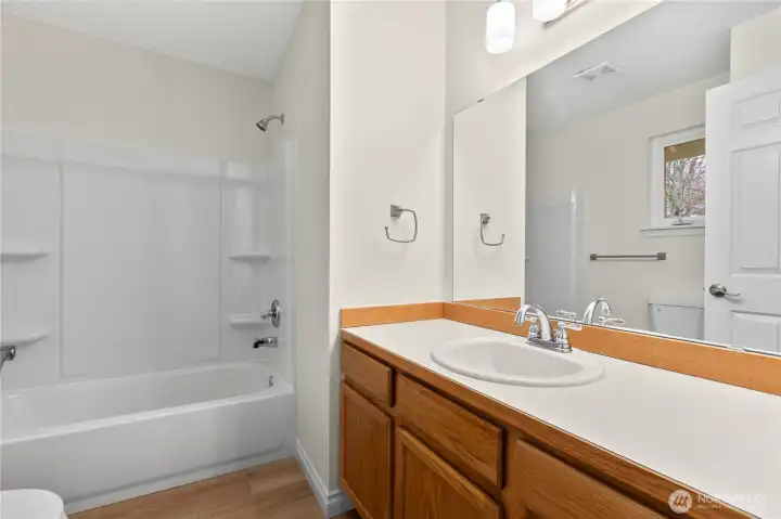 Attached full bathroom in the primary suite