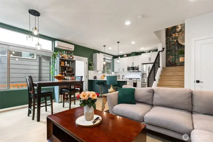 A nice wide, square layout, the home has a great open main floor with room for a dining table and a large sectional.