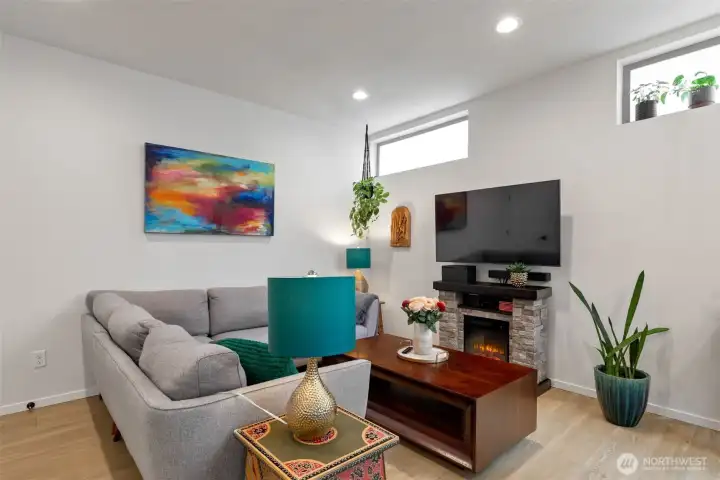 The upper windows have privacy film on them that was professionally installed, an vinyl floor throughout. There is an electric fireplace.heater that can stay if so desired.