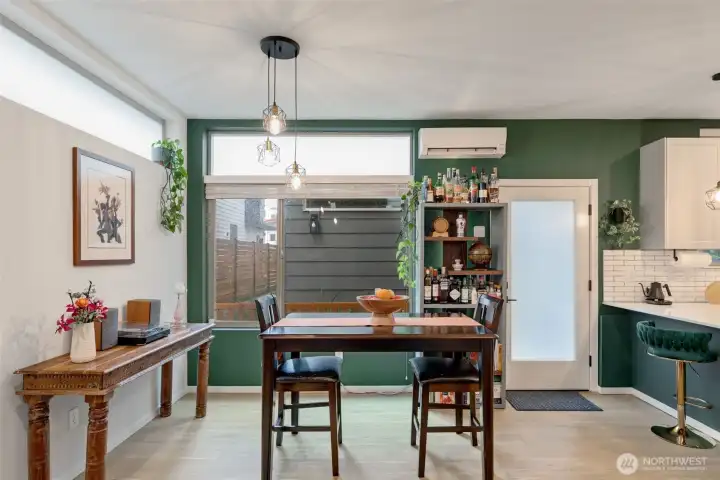 Room for a dining table with a larger sideboard. There are also two mini-splits with different heat pumps and zones. One on the main level and one in the primary suite.