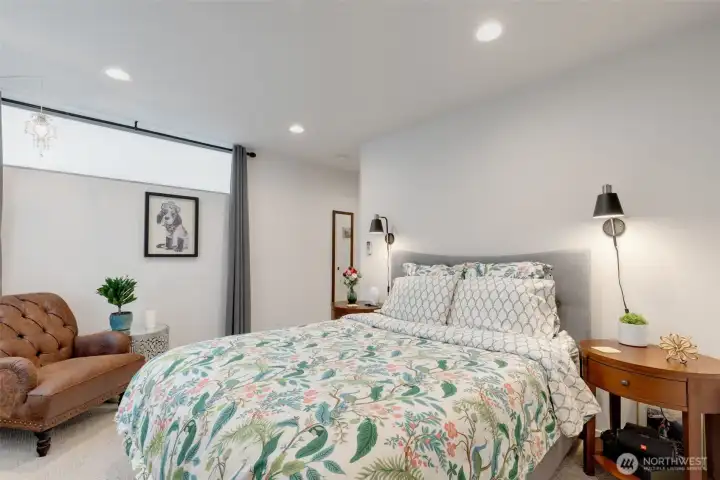 The primary bedroom on the top floor with a full ensuite bath and walk-in closet.