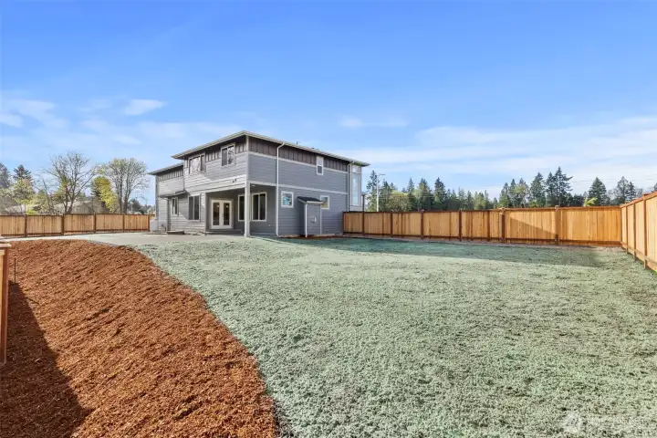 Huge fenced and irrigated back yard.