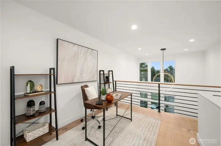 Contemporary open-rail staircase leads to the private upper-level retreats.