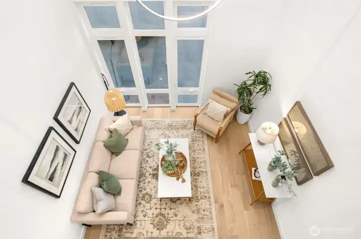 Stunning mezzanine overlook showcases the home's impressive volume and architectural scale.