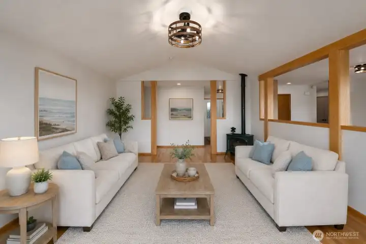 Bright, airy living room with warm wood accents and cozy charm. Bright, airy living room with warm wood accents and cozy charm.