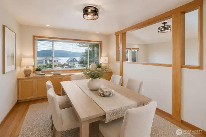 Light-filled dining room with scenic views and warm wood details. Light-filled dining room with scenic views and warm wood details.