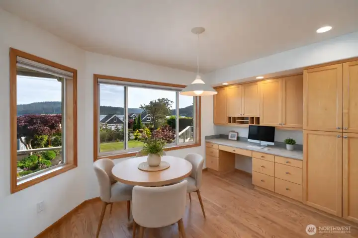 Sunny breakfast nook with built-ins and peaceful neighborhood views. Sunny breakfast nook with built-ins and peaceful neighborhood views.