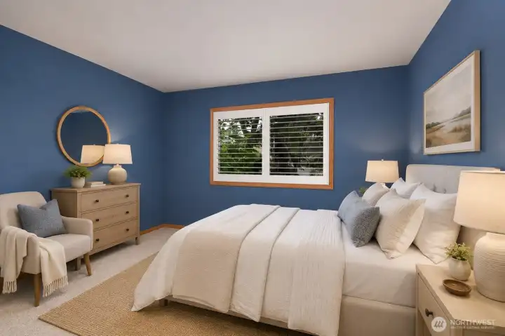Cozy bedroom with rich blue walls and designer-inspired finishes. Cozy bedroom with rich blue walls and designer-inspired finishes.