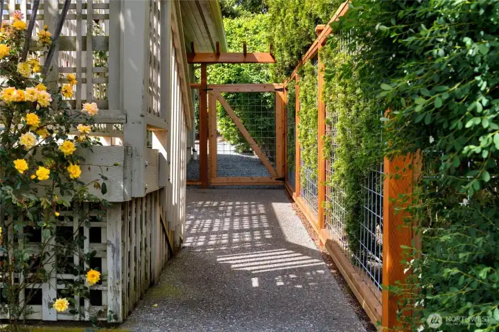 Private garden path with gated access and lush mature landscaping. Private garden path with gated access and lush mature landscaping.