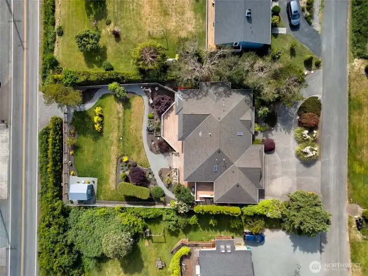 Aerial view showcasing expansive grounds and beautifully landscaped yard. Aerial view showcasing expansive grounds and beautifully landscaped yard.