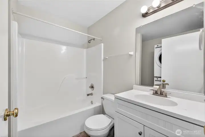 Full bathroom with refreshed vanity, modern fixtures, and full tub/shower combination. Clean finishes and efficient layout provide comfortable everyday functionality with nearby access to the upstairs laundry area.