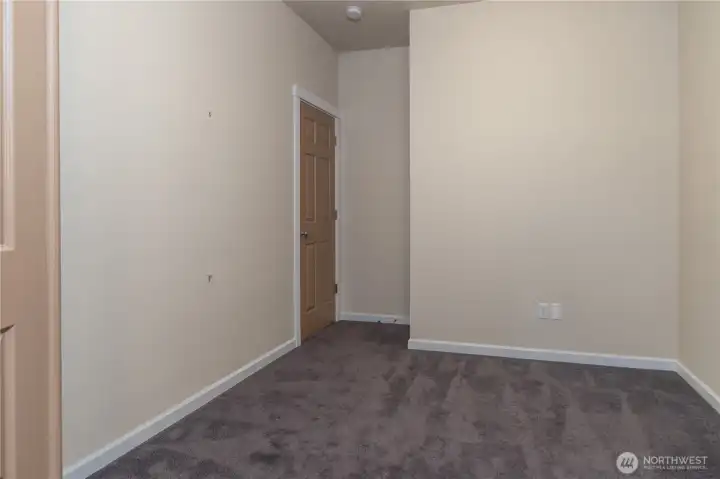 On the left of the entry is the office.