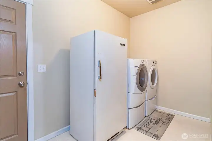 Extra large laundry room with garage access.