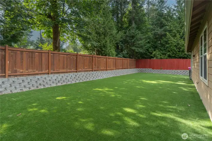 Fully fenced side yard with more easy care tuff.